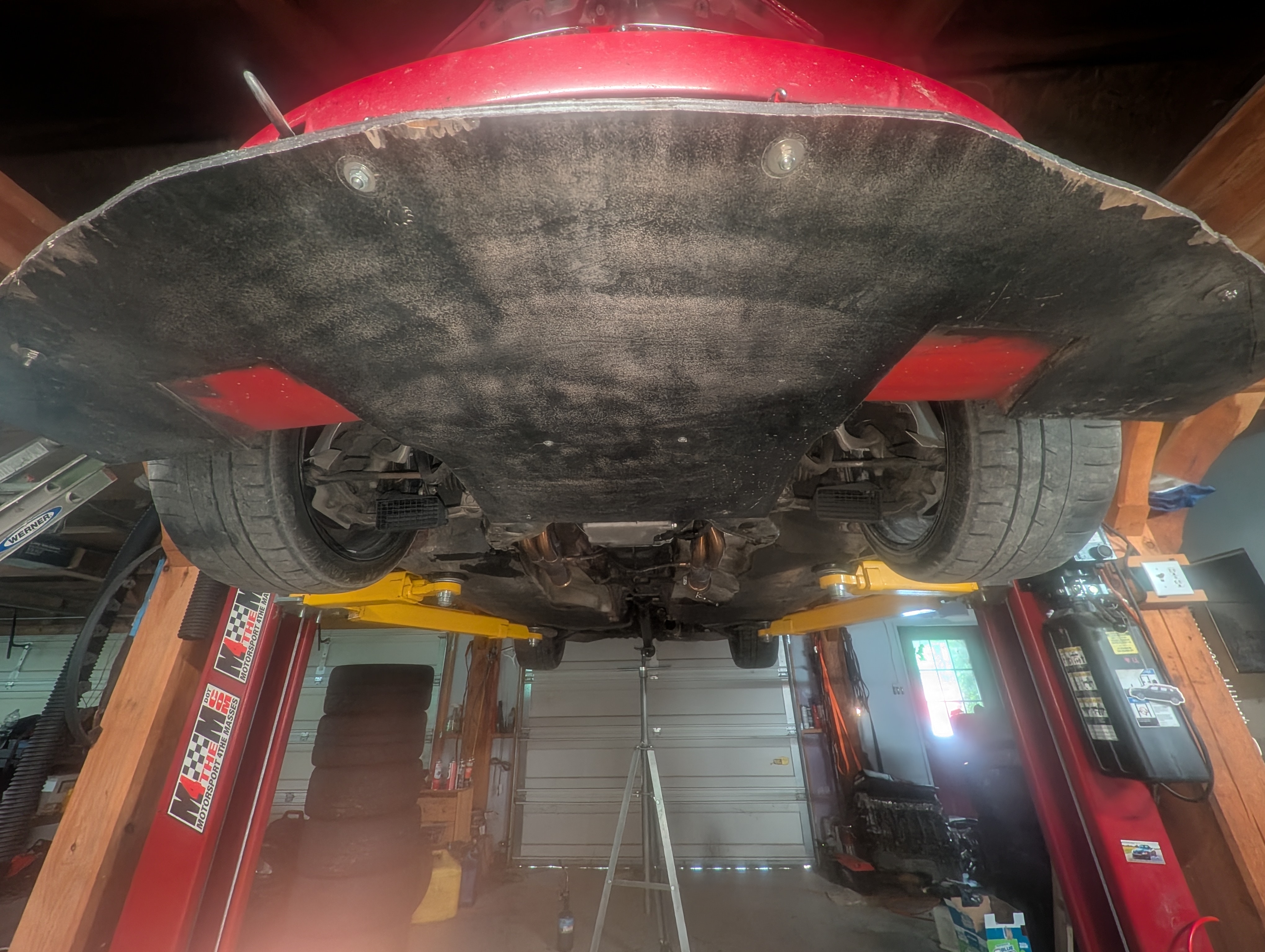 Front undertray and splitter from underneath on the lift