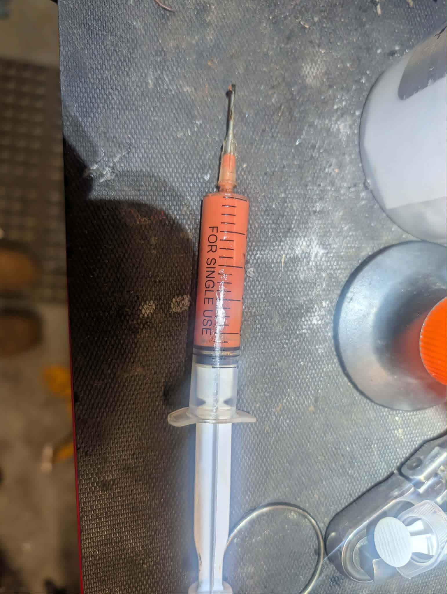 Grease syringe for repacking the CV joint