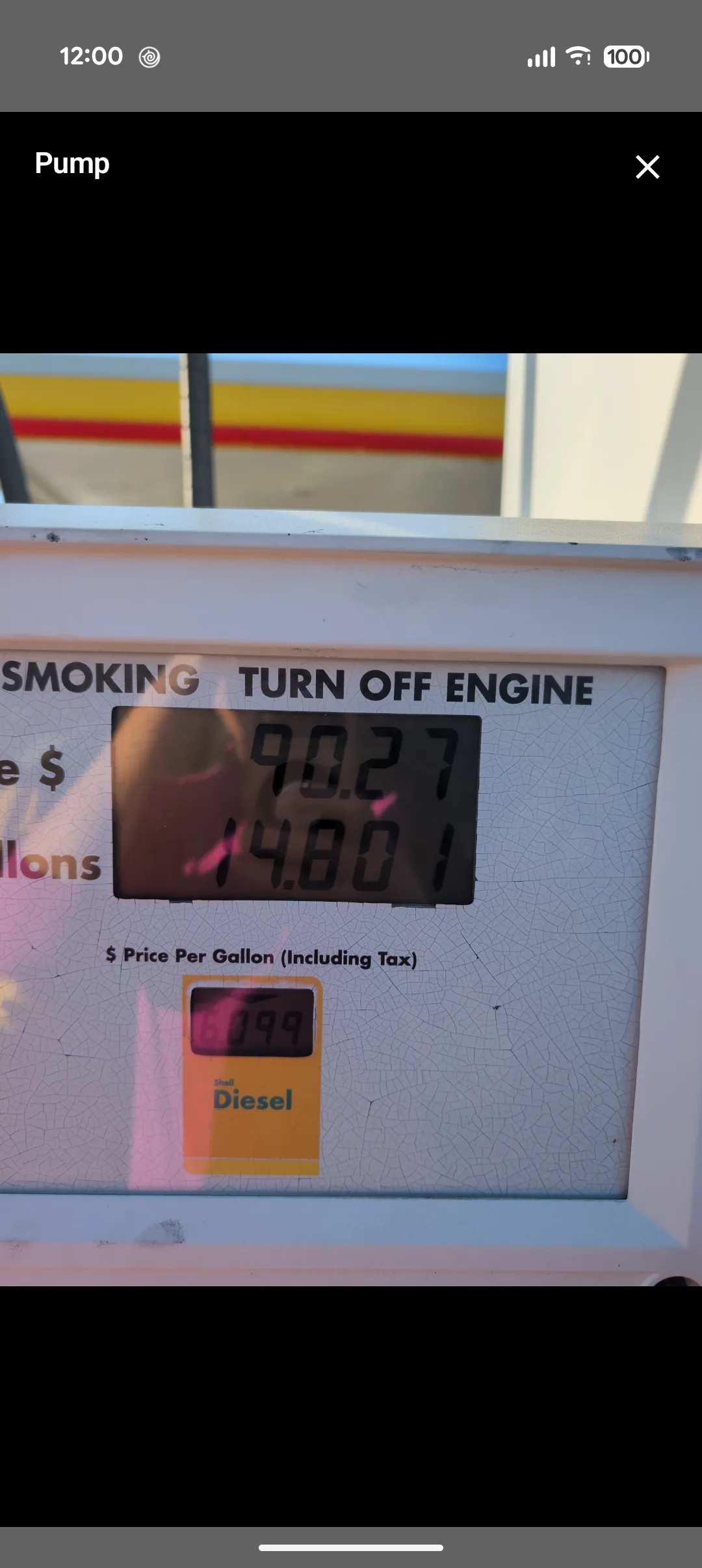 The pump photo behind that fill-up: a Shell diesel pump display showing 90.27 and 14.801, with glare across the readout and a cracked, sun-faded face, price 6.099 a gallon