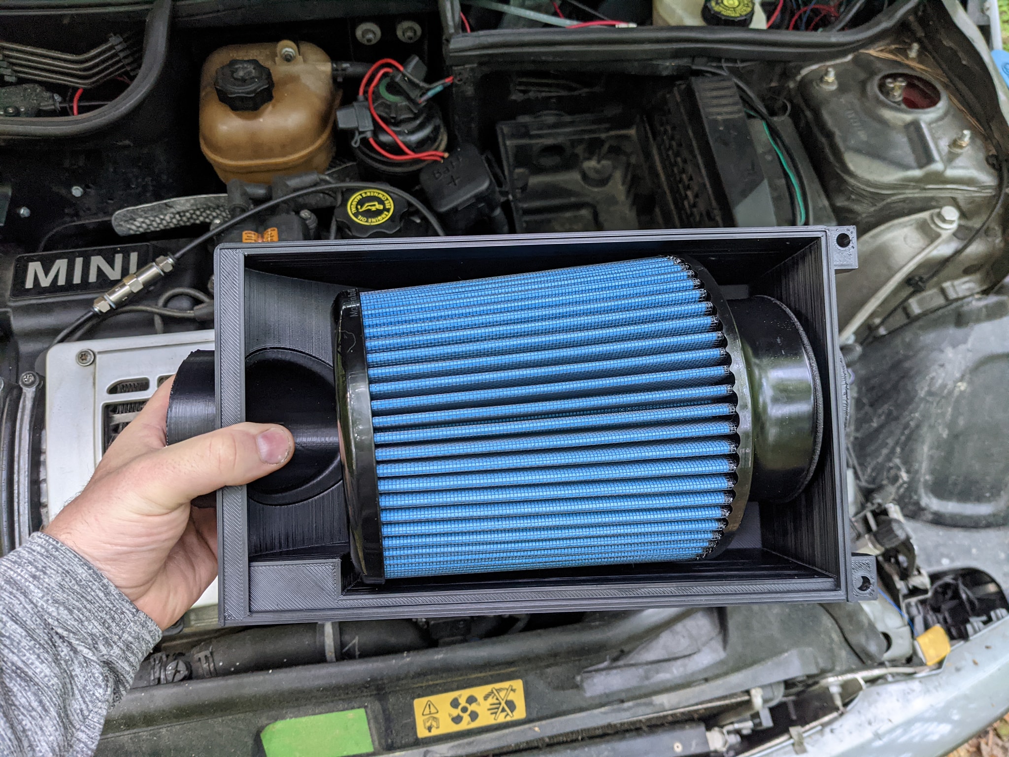 Early black airbox — held over the engine bay