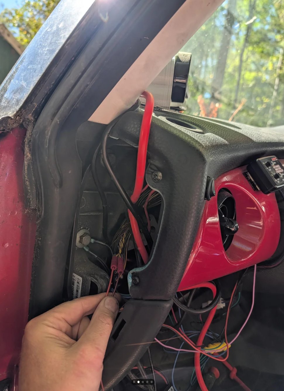 The strip wire routed out of sight up the column