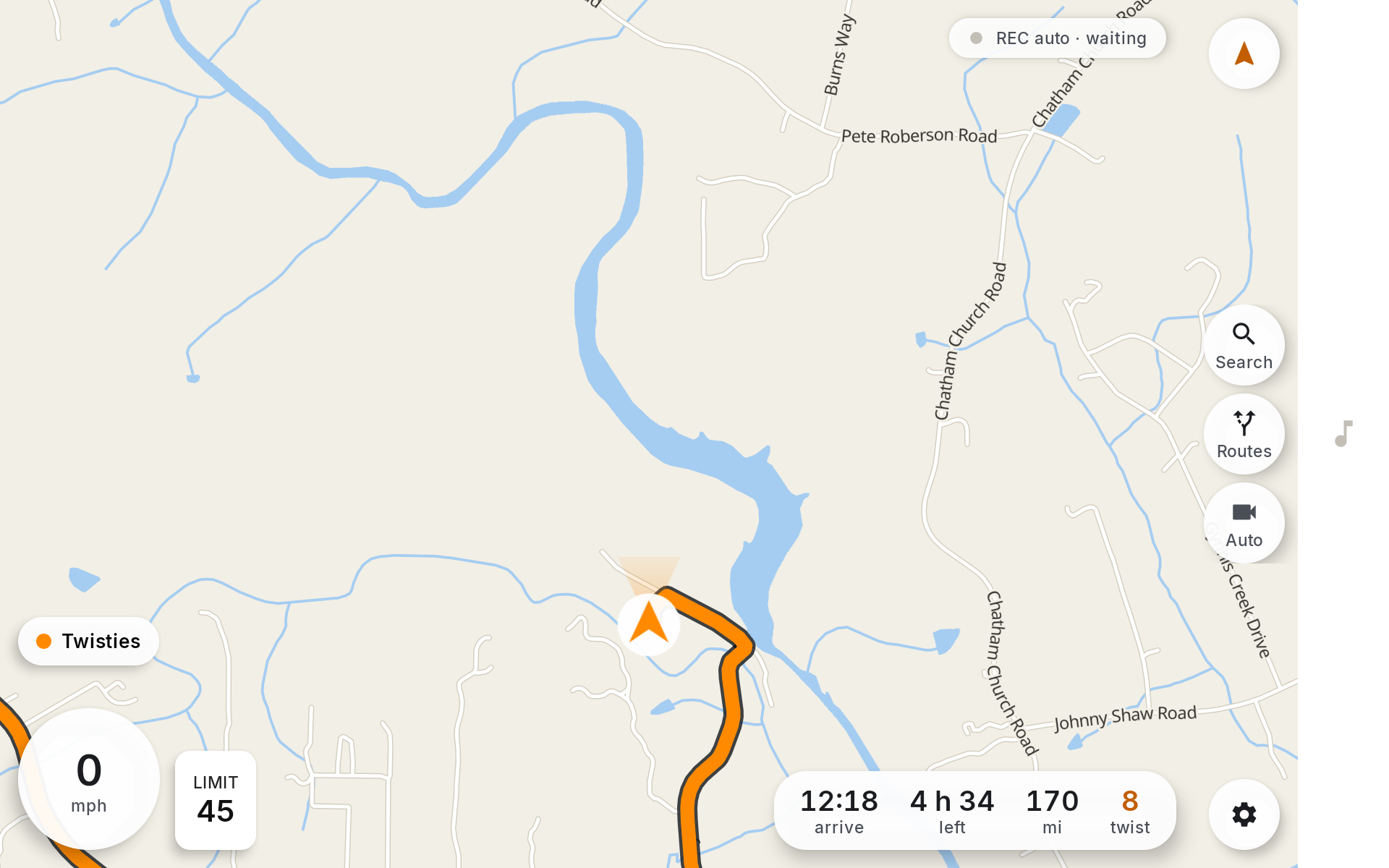 Driving screen with the route drawn, chevron marker, trip strip showing 4 h 34 and 170 miles