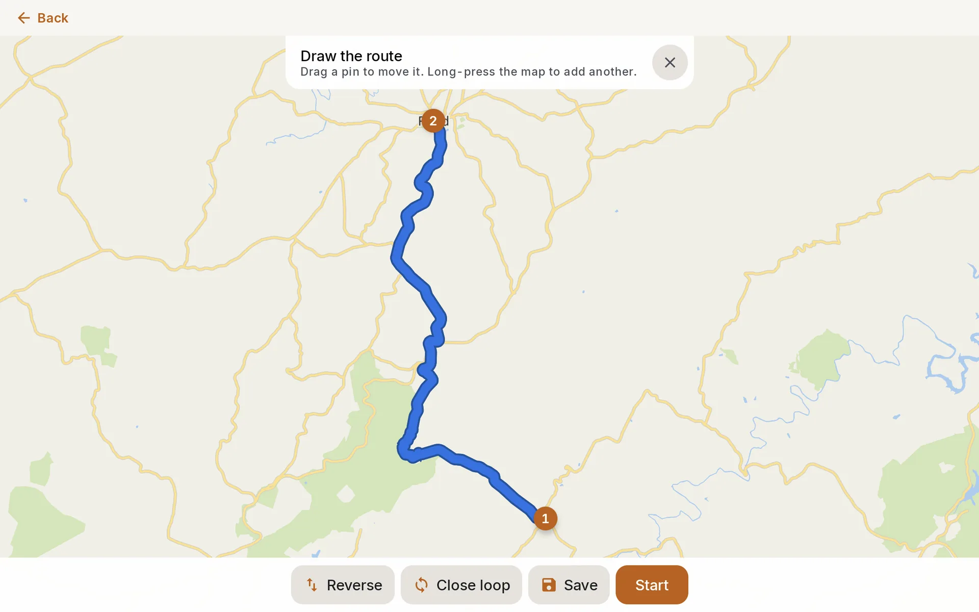 Route editor with two numbered pins at Woolwine and Floyd, Virginia, and the routed line between them on VA 8, with Reverse, Close loop, Save and Start below