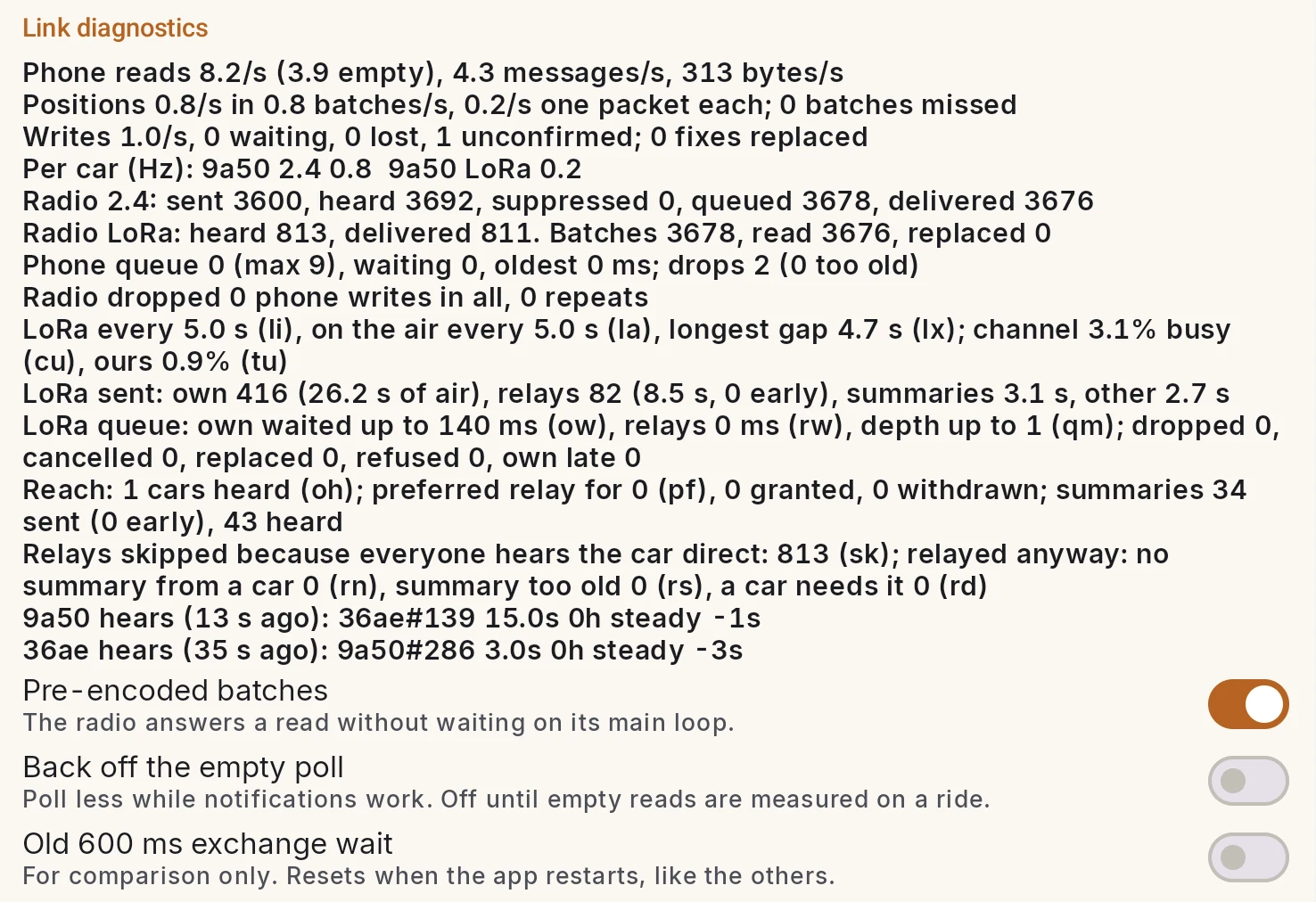 Link diagnostics: phone reads 8.2 a second, positions 0.8 a second in 0.8 batches, 0 batches missed, writes 1.0 a second with 0 lost, per car 9a50 on 2.4 GHz at 0.8 Hz and LoRa at 0.2 Hz, radio 2.4 and LoRa counters, phone queue, radio dropped 0 phone writes, then LoRa airtime, queue, reach and relay lines, and three switches for testing the Bluetooth link